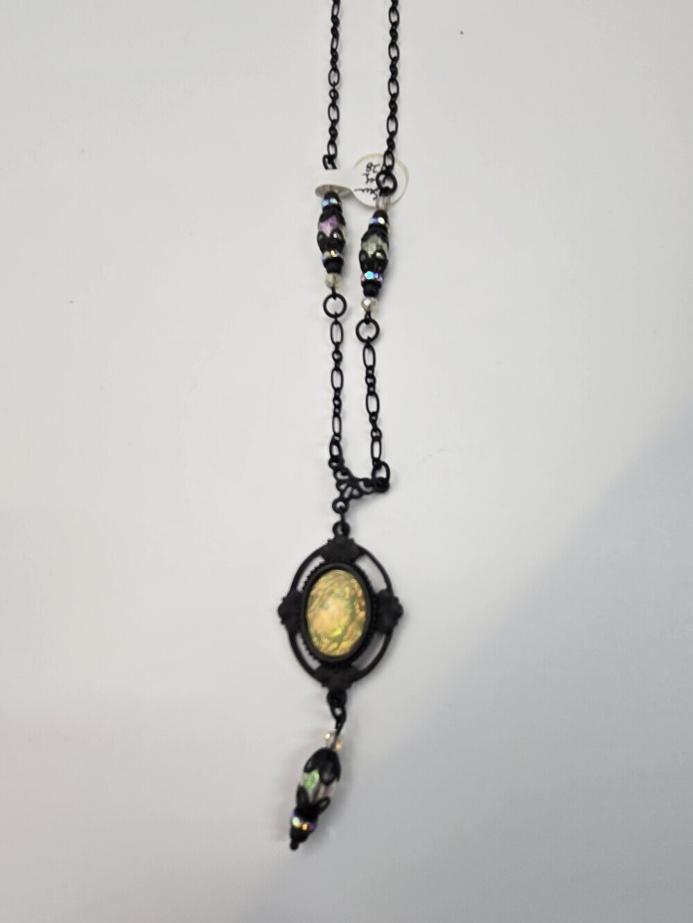 Gothic-style Black Enamel Pendant Necklace Featuring a Fire Opalescent Gem